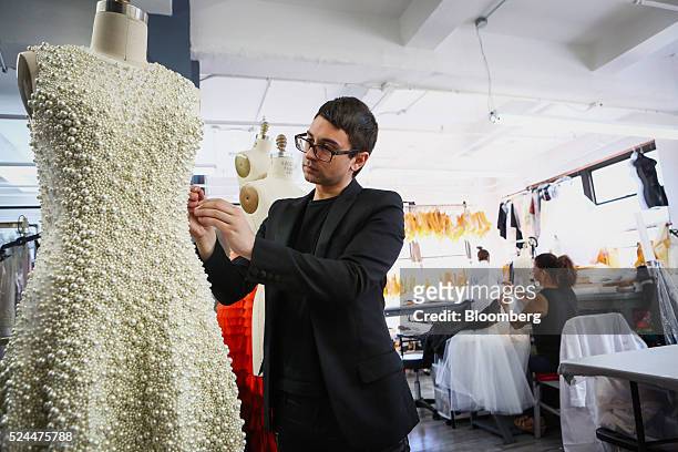 Designer Christian Siriano works at his studio in New York, U.S., on Wednesday, April 20, 2016. Since winning the fourth season of the fashion...