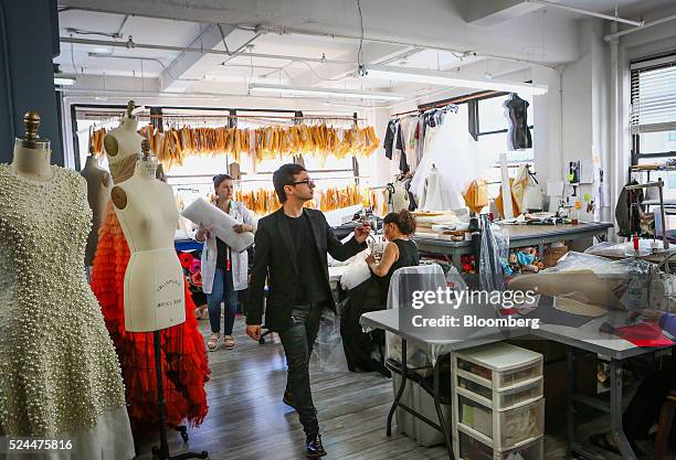 Designer Christian Siriano works at his studio in New York, U.S., on Wednesday, April 20, 2016. Since winning the fourth season of the fashion...