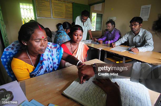 Women members of Village Financial Services Pvt Ltd, which is joint liability group for sustainable development, gather to complete formalities of...