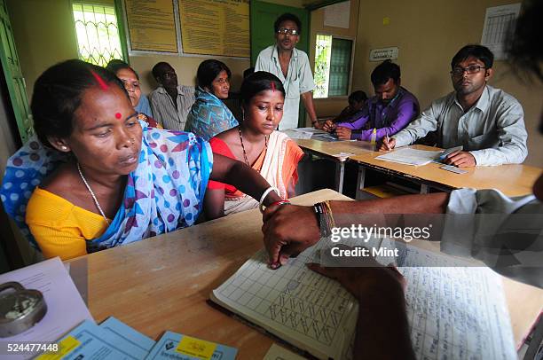 Women members of Village Financial Services Pvt Ltd, which is joint liability group for sustainable development, gather to complete formalities of...
