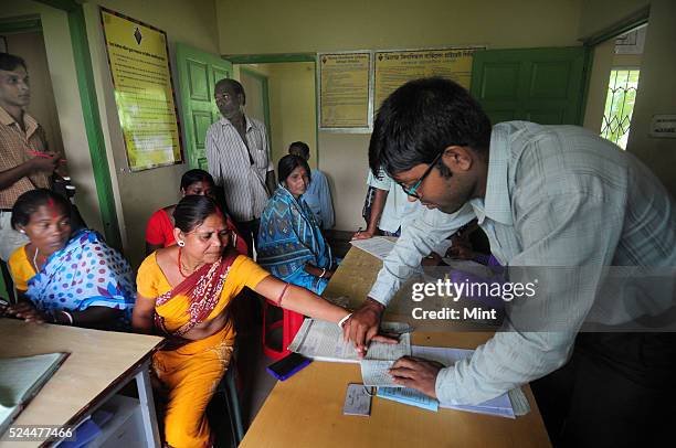Women members of Village Financial Services Pvt Ltd, which is joint liability group for sustainable development, gather to complete formalities of...