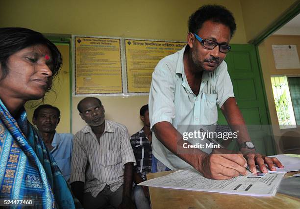 Women members of Village Financial Services Pvt Ltd, which is joint liability group for sustainable development, gather to complete formalities of...