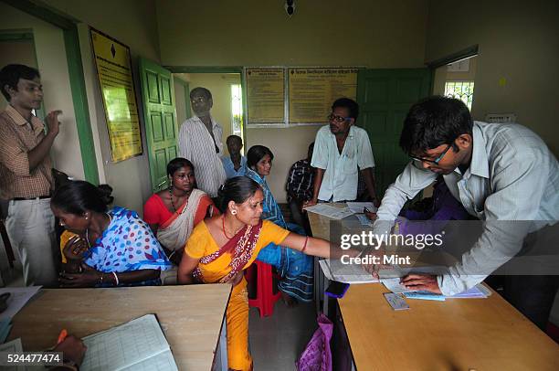 Women members of Village Financial Services Pvt Ltd, which is joint liability group for sustainable development, gather to complete formalities of...