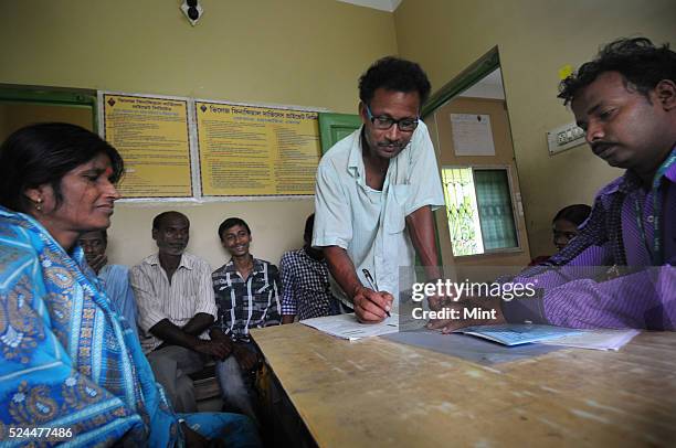 Women members of Village Financial Services Pvt Ltd, which is joint liability group for sustainable development, gather to complete formalities of...