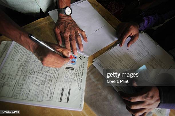 Women members of Village Financial Services Pvt Ltd, which is joint liability group for sustainable development, gather to complete formalities of...