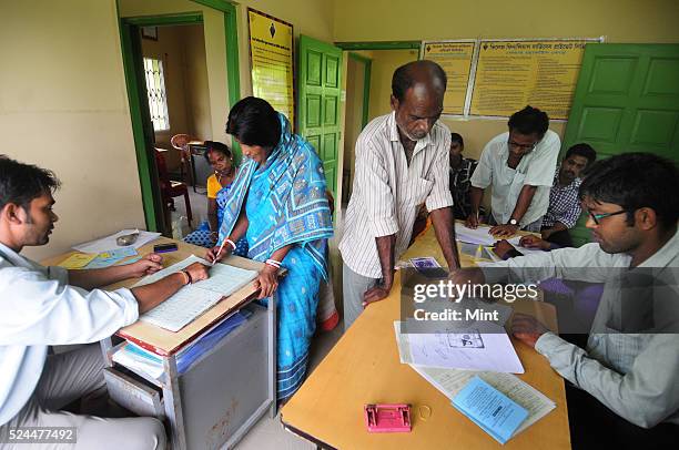 Women members of Village Financial Services Pvt Ltd, which is joint liability group for sustainable development, gather to complete formalities of...