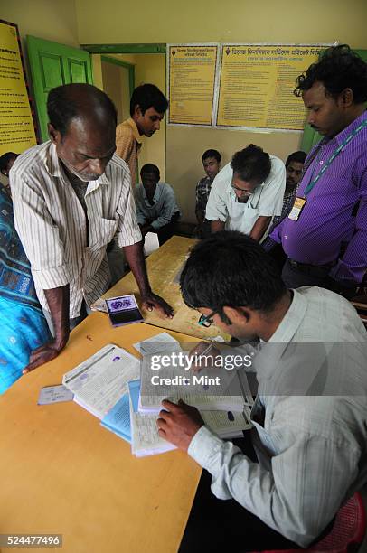 Women members of Village Financial Services Pvt Ltd, which is joint liability group for sustainable development, gather to complete formalities of...