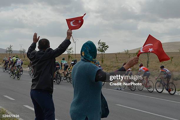 Local couple watches the TUR as riders from the first breakaway group pass by during the third stage of the 52nd Presidential Tour of Turkey 2016,...