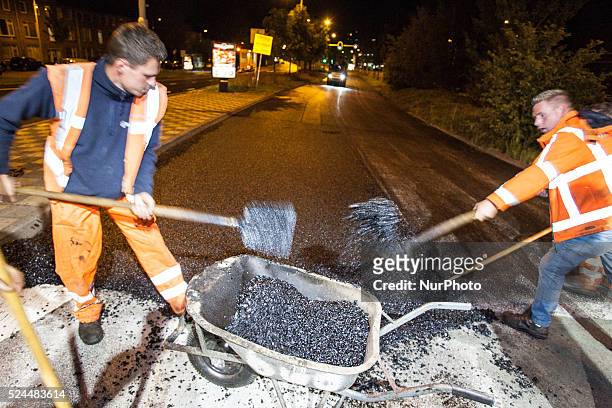 The Netherlands - Part of the entrance road to the university city is given a new top layer of asphalt. Such work is increasingly being done at...