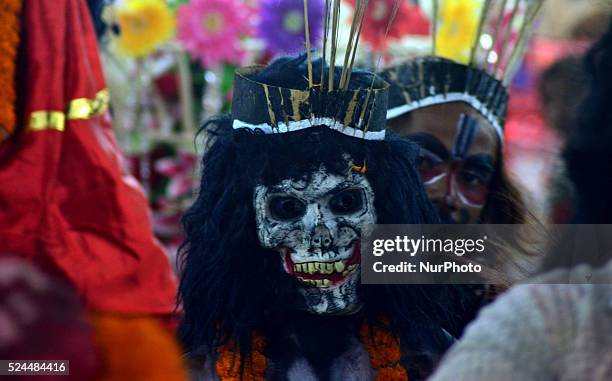 An Indian artist dressed as the Demon , takes part in a 'Ravan ki Barat' procession held to mark the forthcoming Dussehra festival in Allahabad on...