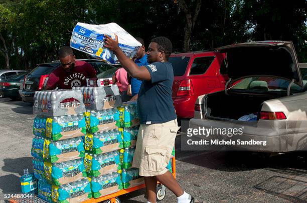 August 23, 2012 RUDDENS CHERELUS, IFRATHIEU ST. LOUIS, MARY AND EDGAR SIRENORD purchase food, beverages and supplies in preparation for Storm Isaac....