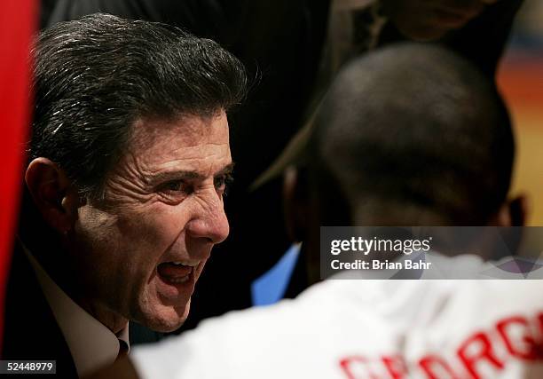 Head coach Rick Pitino of the Louisville Cardinals gets animated as he talks to his team during a stoppage in play against the Louisiana-Lafayette...