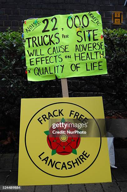 The light shining on placards outside the council offices of Lancashire County Council in Preston, on Wednesday 28th January 2015, to urge LCC to...
