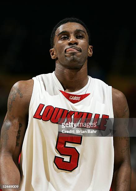 Taquan Dean of the Louisville Cardinals walks off the court during a stoppage in play against the Louisiana-Lafayette Ragin' Cajuns in the first...