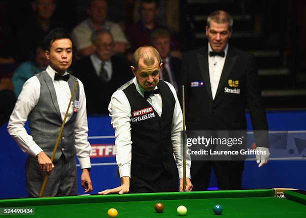 Barry Hawkins of England looks on during his quarter final match against Marco Fu from Hong Kong on day eleven of the World Championship Snooker at...
