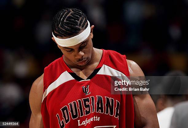 Dewayne Mitchell of the Louisiana-Lafayette Ragin' Cajuns hangs his head after losing to the Louisville Cardinals in the first round of the NCAA...
