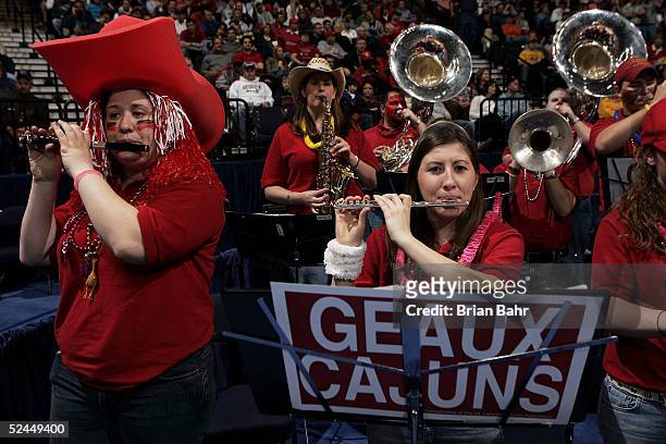 The Louisiana-Lafayette Ragin' Cajuns band plays during the game against the Louisville Cardinals in the first round of the NCAA Division I Men's...