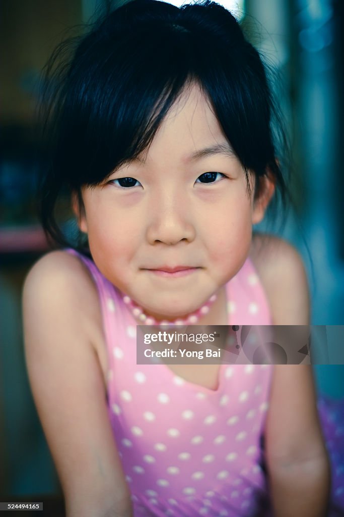 Young girl in pink shirt