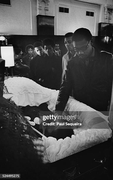 Inside the Rayner Funeral Home, members of the community file past the open casket of Fred Hampton, the slain Black Panther Party leader, to pay last...