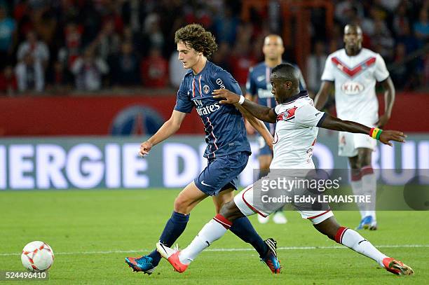 Adrien Rabiot of PSG vies for the ball with Henri Saivet of Bordeaux during the French Ligue 1 soccer match, Paris Saint Germain vs Girondins de...