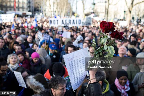 People holding cardboards reading &quot;Je suis Charlie take part in a Unity rally "Marche Republicaine" on the Place de la Republique in Paris on on...