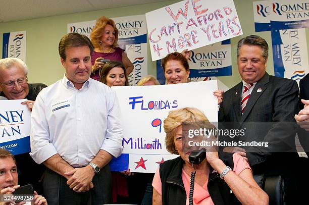 October 8, 2012 BETTY DOUGLAS AT THE PHONE MAKING THE 9 MILLION CALL TO A VOTERS. IN PICTURE ADAM HASNER, CHIP LaMARCA. Mother and Sister of Paul...