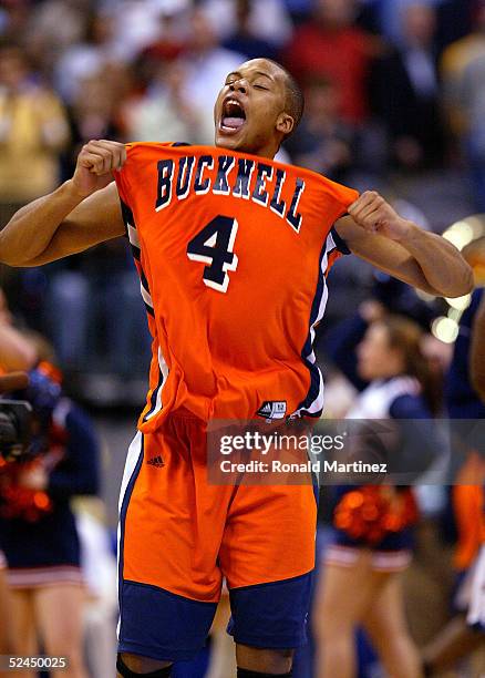 Donald Young of the Bucknell Bison screams as his team upset the Kansas Jayhawks during the first round of the NCAA Men's Basketball Championship on...