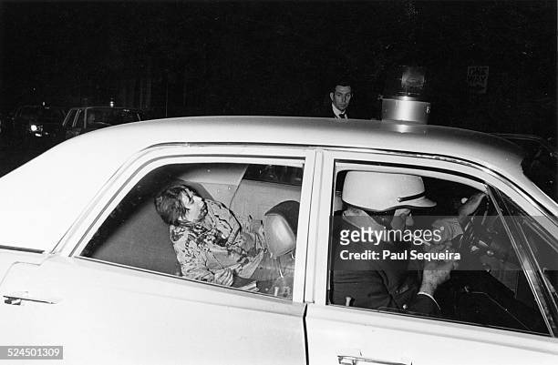 Bloodied member of the SDS sits in the backseat of a police car at the end of a violent day of protest, Chicago, Illinois, October 11, 1969. In the...