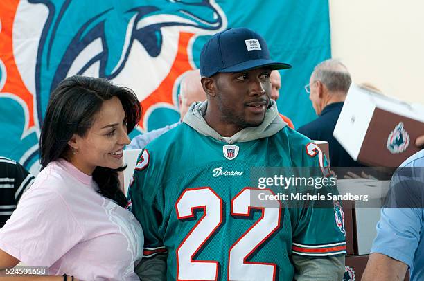 November 21, 2012 - REGGIE BUSH GIRL FRIEND LILIT AVAGYAN. Miami Dolphins Host Multiple Thanksgiving Meal Distributions Throughout South Florida....