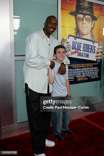 John Salley and Frankie Muniz arrive at the Paramount Pictures premiere of "Dickie Roberts: Former Child Star," to benefit the Chris Farley...