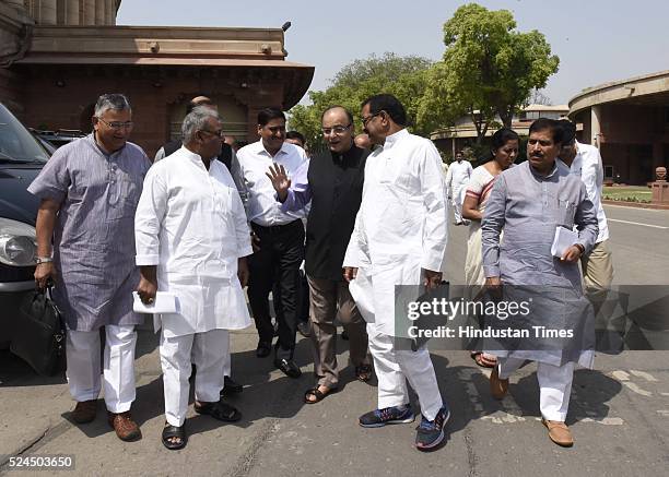 Minister of Finance Arun Jaitley talking with other BJP Members of Parliament after attending the BJP Parliamentary board meeting at Parliament...