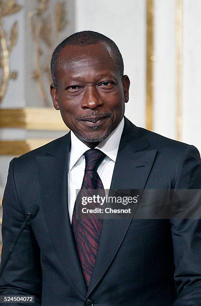 Benin's President Patrice Talon makes a statement during a press conference with French President Francois Hollande at the Elysee Palace on April 26,...