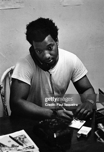 Black Panther Party leader Fred Hampton speaks on the telephone while at Panther Headquarters on 2350 West Madison Avenue, Chicago, Illinois, 1969.