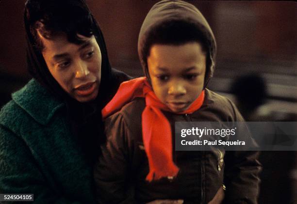 Inside the Rayner Funeral Home, a mother and her son file past the open casket of Illinois Black Panther Party chapter chairman Fred Hampton's...