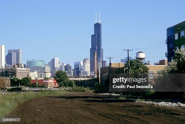 View looking east, from a vacant lot, at the Willis Towers, formerly the Sears Towers,, Chicago, Illinois, 1980s.