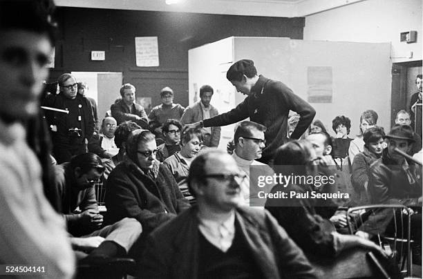 Black Panther Party member Bobby Lee speaks to a white audience at a community meeting in the Uptown neighborhood, Chicago, Illinois, 1969.