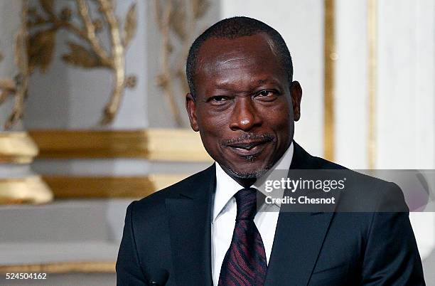 Benin's President Patrice Talon makes a statement during a press conference with French President Francois Hollande at the Elysee Palace on April 26,...