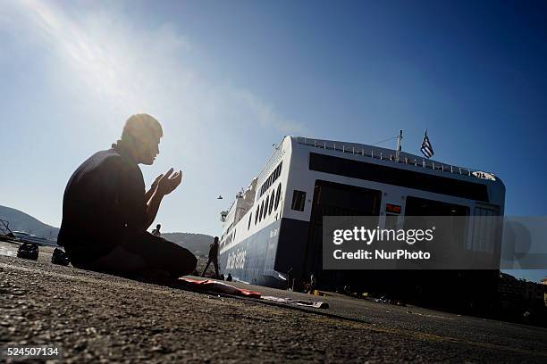 Refugees and migrants wait at the port of Mytilene for the 48-hour strike of the dock workers to end so they can get in the ferries and head to the...