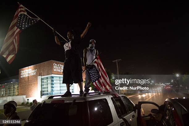 Protesters in front of the Ferguson Police Headquarters ahead of the 1-year-anniversary of the death of Michael Brown on August 7, 2015 in Ferguson,...