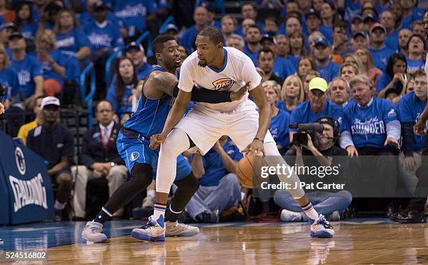 Kevin Durant of the Oklahoma City Thunder prices around Wesley Matthews of the Dallas Mavericks during Game Five of the Western Conference...