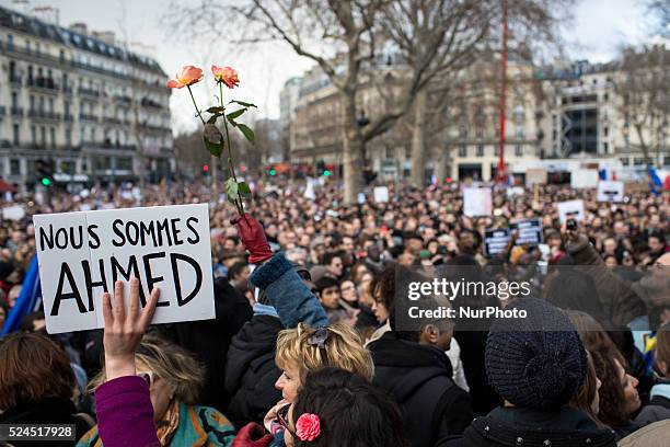 People holding cardboards reading &quot;Je suis Charlie take part in a Unity rally "Marche Republicaine" on the Place de la Republique in Paris on on...