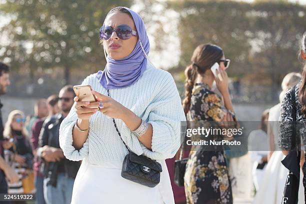 Models, photographers and fashion professionals are seen gathering outside the shows during Paris Fashion Week. Formal shows take place on the runway...