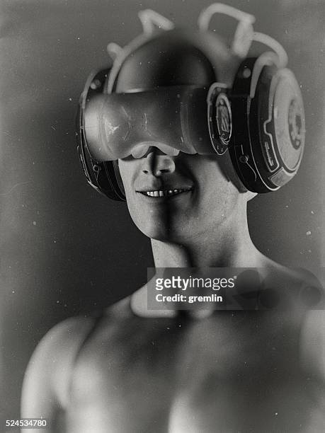 virtual reality goggles and futuristic man - man robot stockfoto's en -beelden