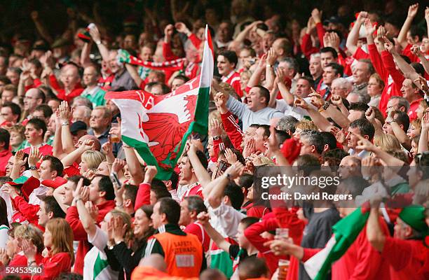 Welsh fans celebrate as Wales win the Grand Slam after defeating Ireland in the RBS Six Nations International between Wales and Ireland at The...