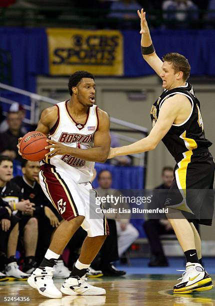 Craig Smith of the Boston College Eagles looks to play the ball against Adrian Tigert of the Wisconsin-Milwaukee Panthers during the second round of...