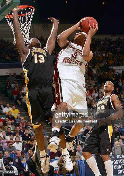 Jared Dudley of the Boston College Eagles is fouled by Joah Tucker of the Wisconsin-Milwaukee Panthers during the second round of the 2005 NCAA...