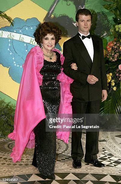 Actress Gina Lollobrigida and Javier Rigau Rifols arrive at the Rose Ball 2005 at The Sporting Monte Carlo on March 19, 2005 in Monte Carlo, Monaco.