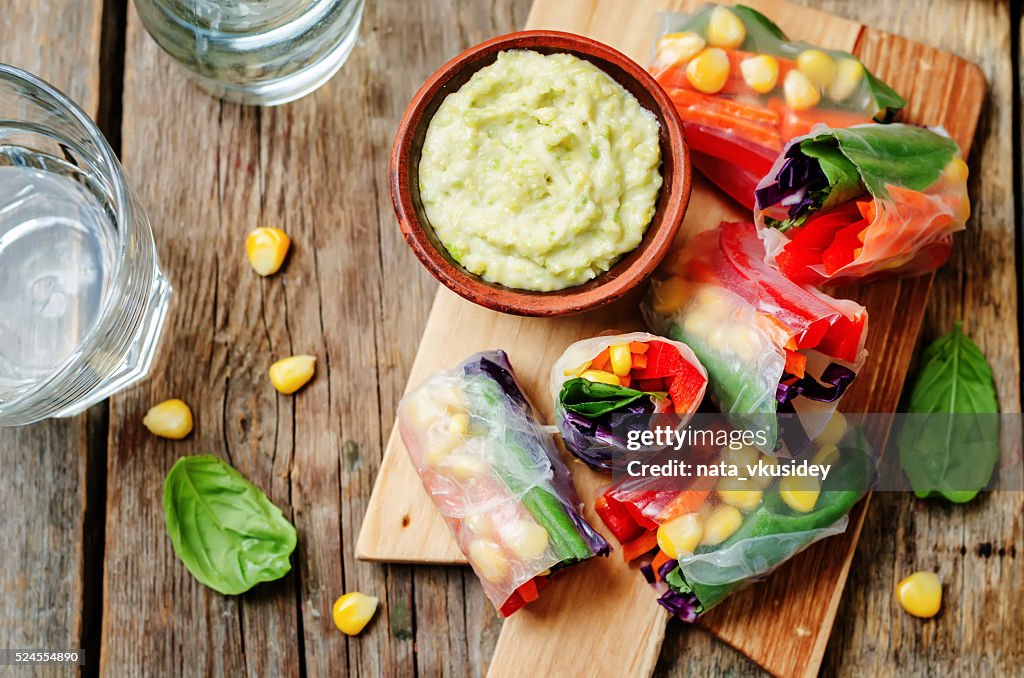 Rainbow spring rolls with avocado white bean hummus