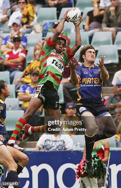 Roy Bell of the Rabbitohs marks over Matt Petersen of the Eels during the NRL round 2 match between the South Sydney Rabbitohs and the Parramatta...