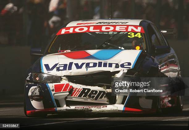 Andrew Jones of the Garry Rogers Motorsport Team limps back to the pits after a collision during race two of the Clipsal 500 which is round one of...